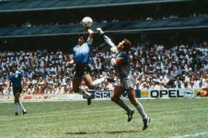 Argentina's Diego Maradona scores their first goal with his hand over Peter Shilton of England-1753130